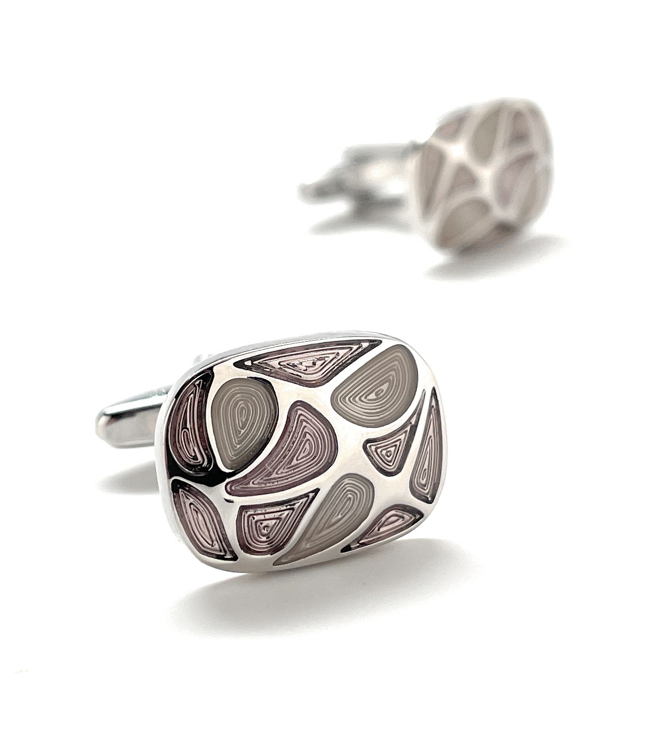A pair of modern abstract silver cufflinks featuring artistic swirl patterns in soft purple and gray tones, designed by JayPins for a bold and contemporary men’s fashion statement.