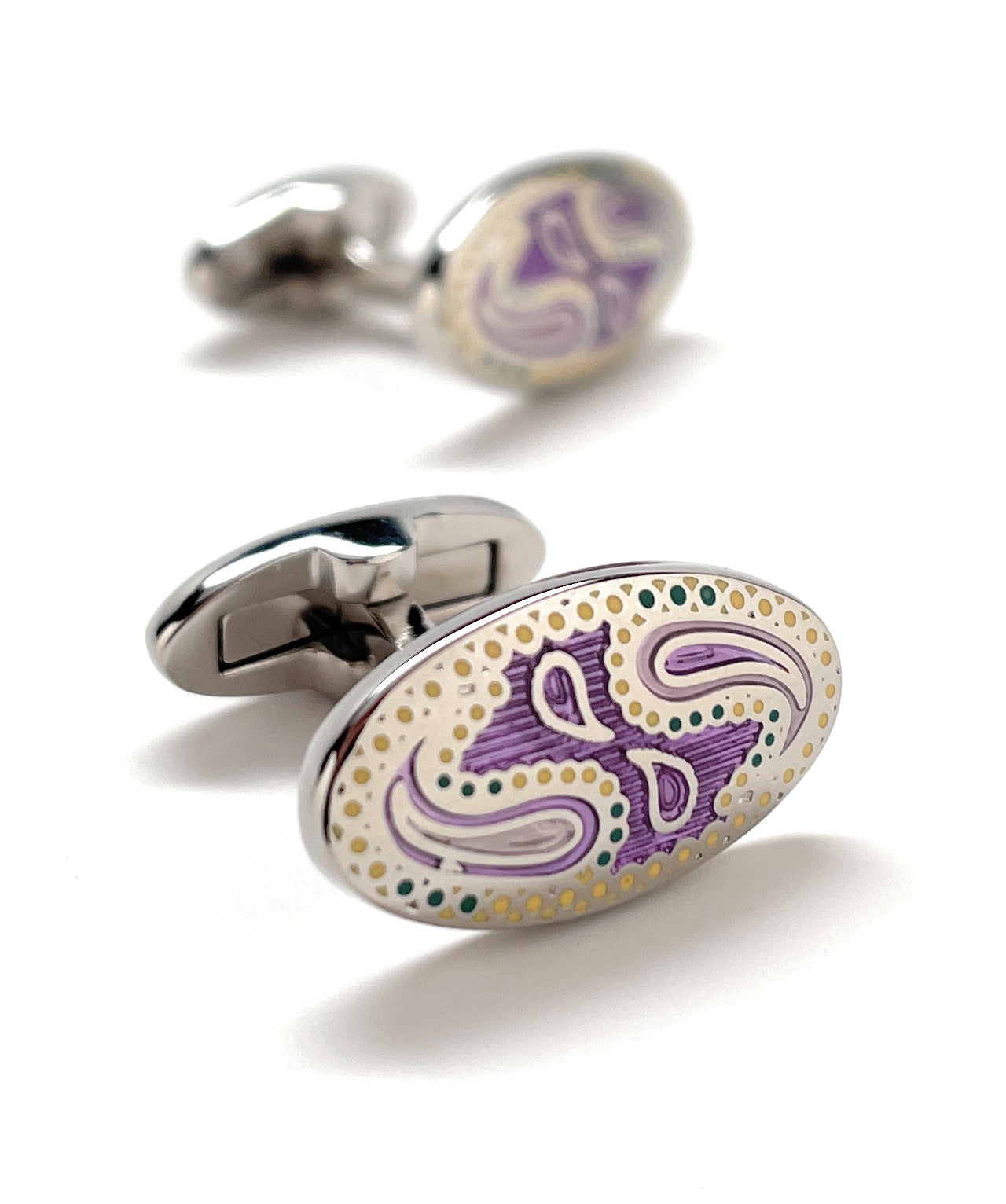 A pair of JayPins Purple Paisley cufflinks with elegant enamel detailing in purple, cream, and gold tones set in polished silver oval frames, symbolizing classic men’s sophistication and modern flair.