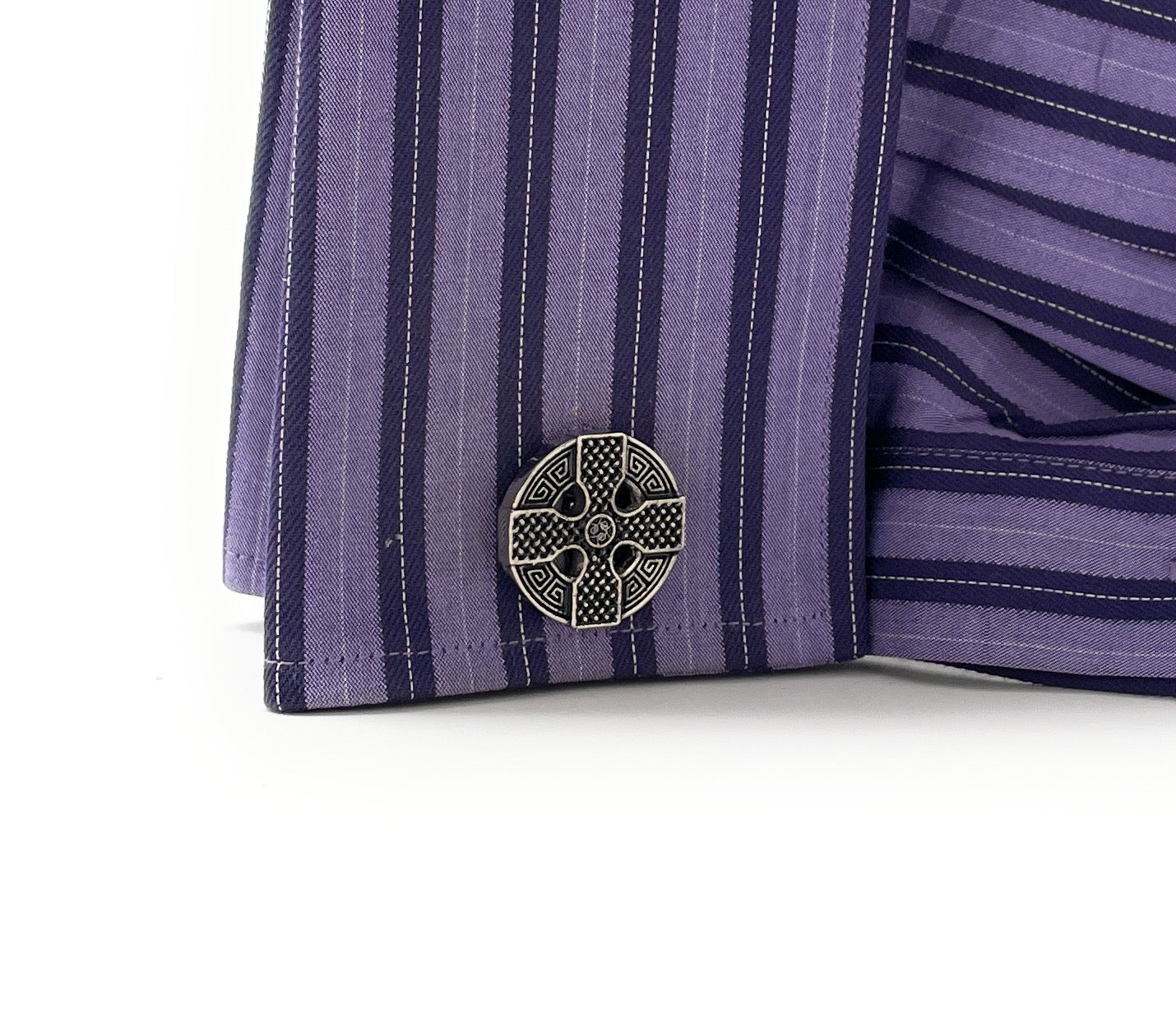Purple striped fabric with a central emblem on a white background