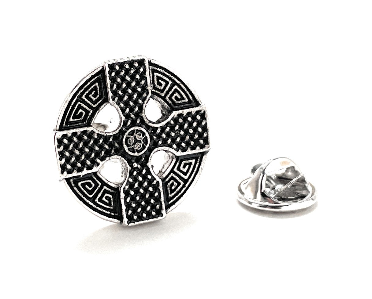 Black and silver decorative lapel pin on a white background