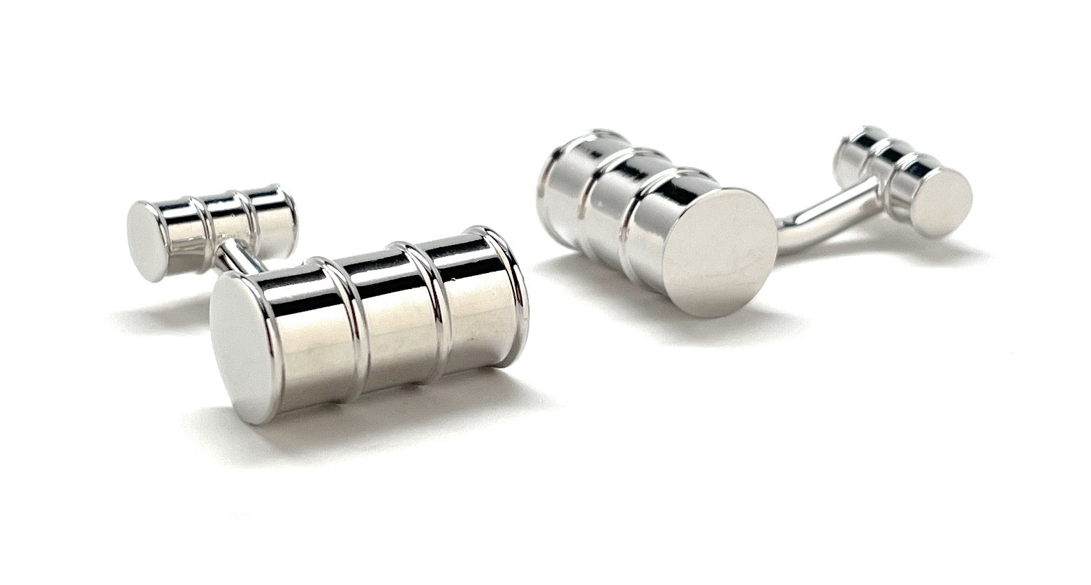 Pair of silver cufflinks on a white background