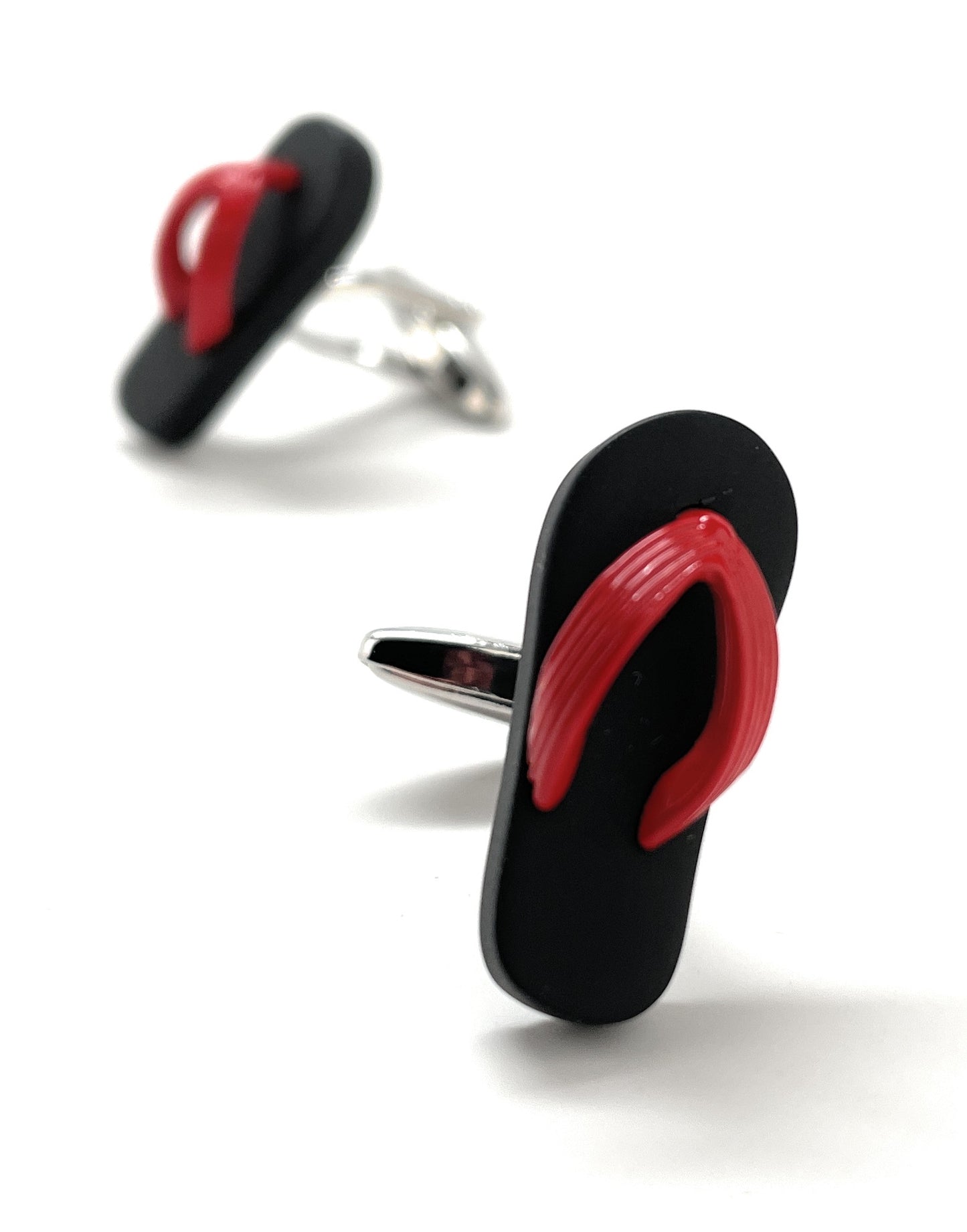Black and red flip-flop cufflinks on a white background