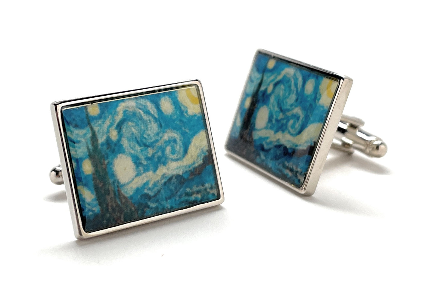 Square cufflinks with blue and gold abstract design on a white background
