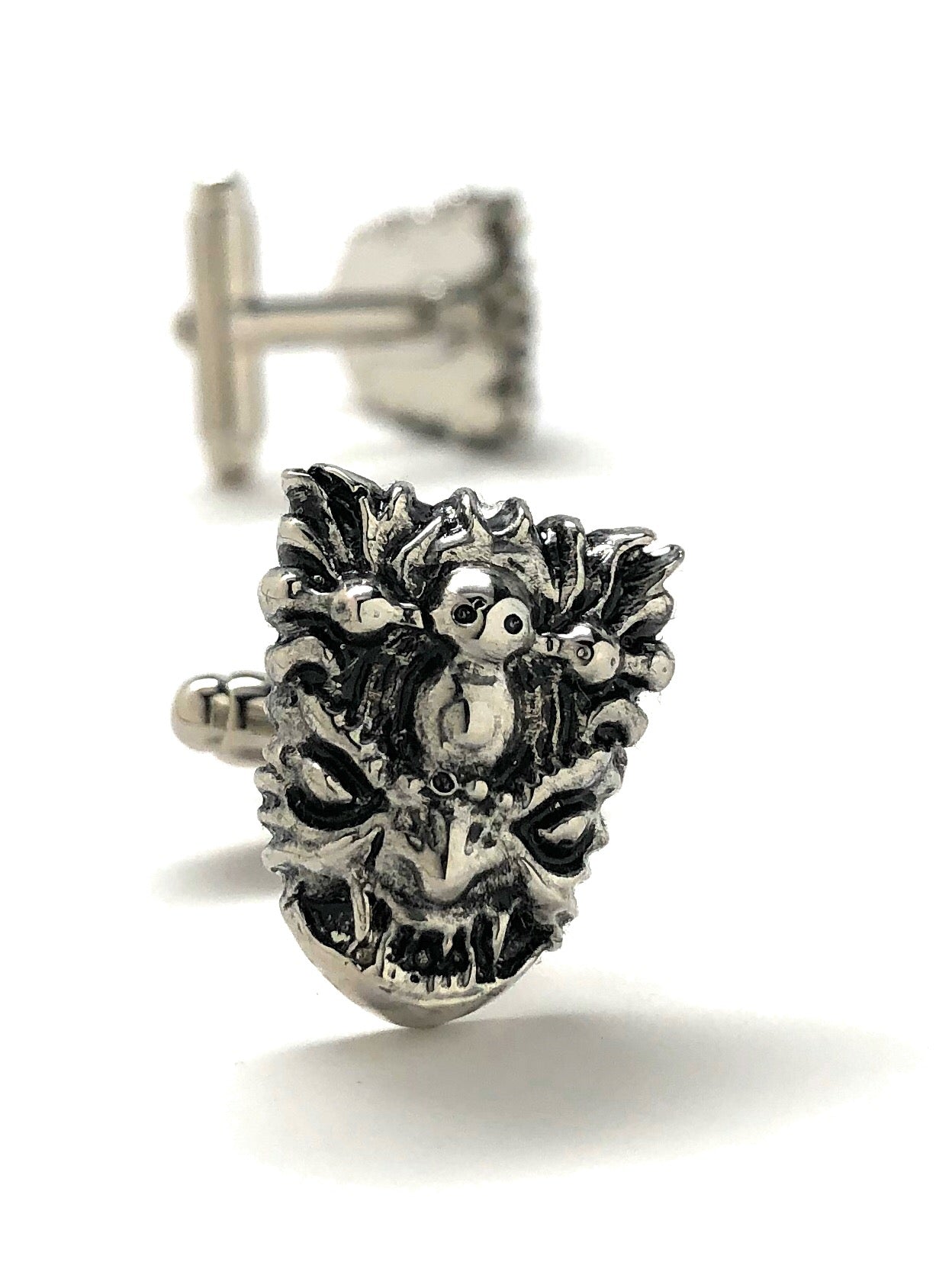 Silver yeti-themed earring on a white background