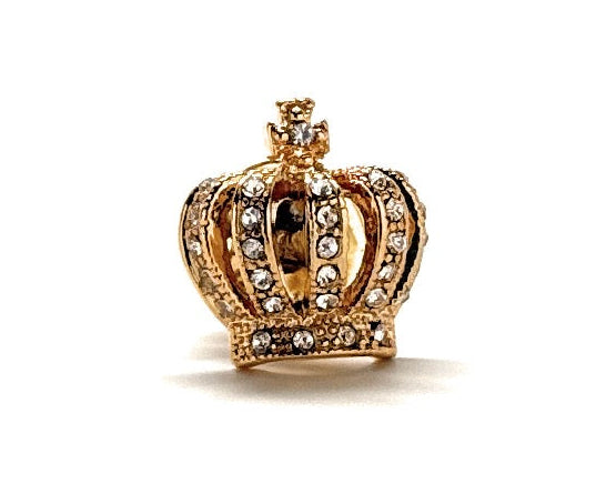 Gold crown-shaped object on a white background