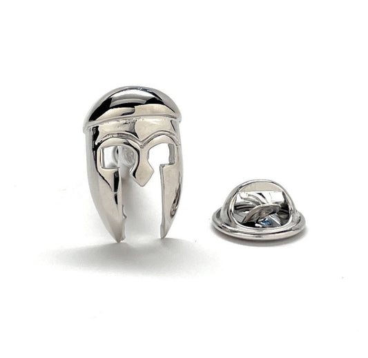 A silver-colored enamel pin shaped like an ancient Greek hoplite helmet, accompanied by a rhodium plated butterfly back.