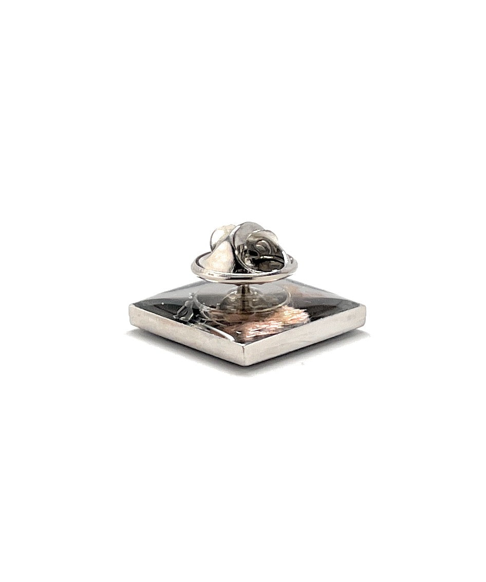 Silver inkwell with a round inkstone on a white background