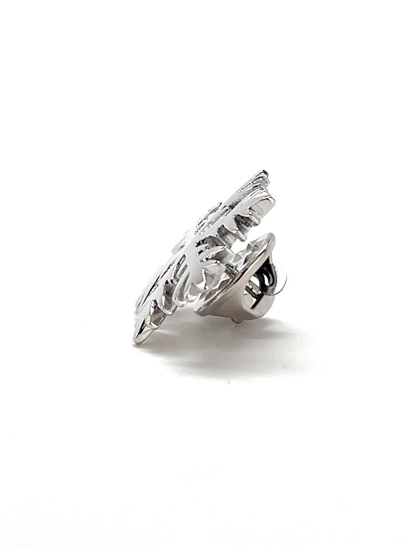Silver ring with a large clear gemstone on a white background