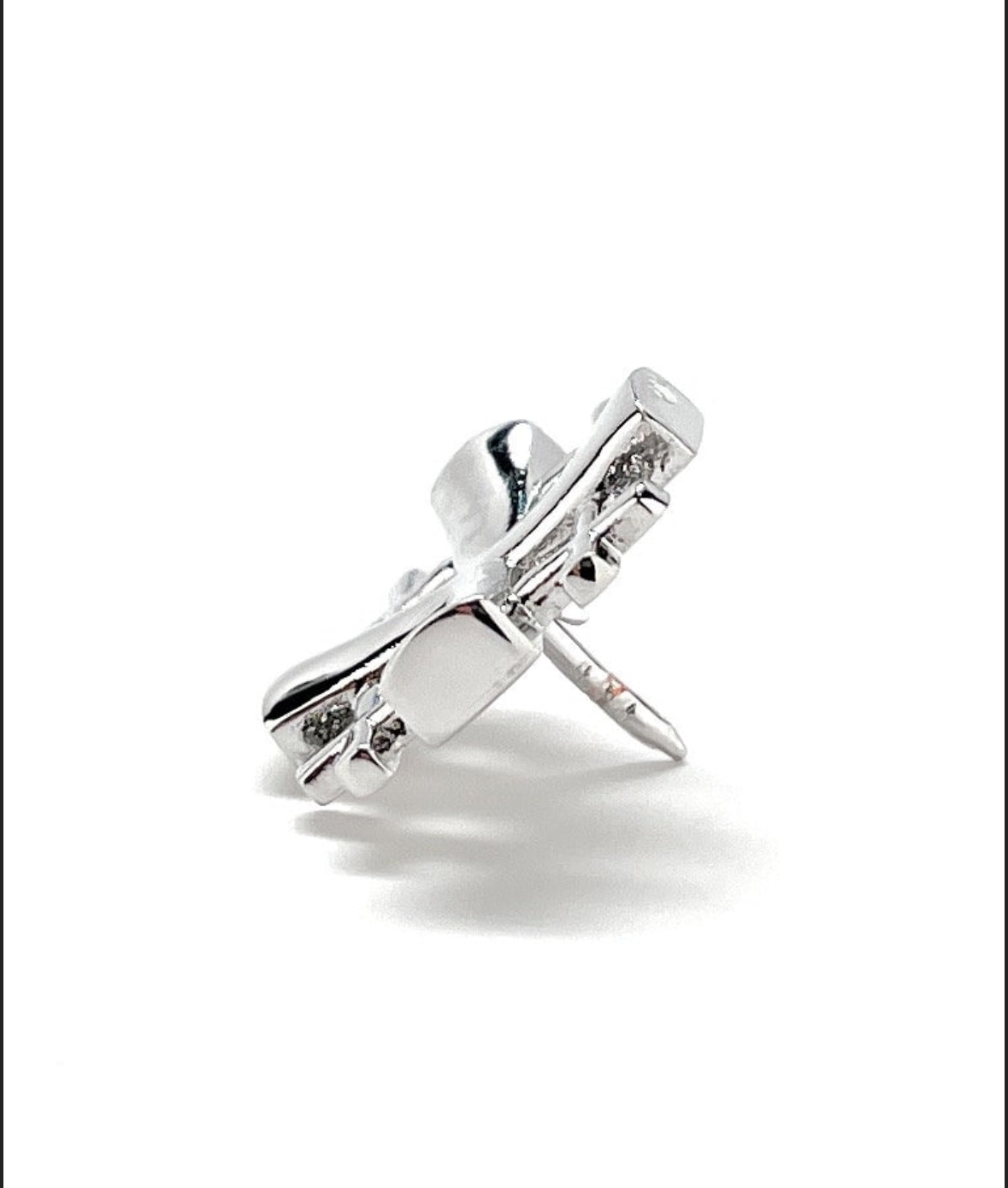A silver-tone Jerusalem Cross lapel pin with a 3D butterfly back, showing an enamel pin with a reflective silver finish.