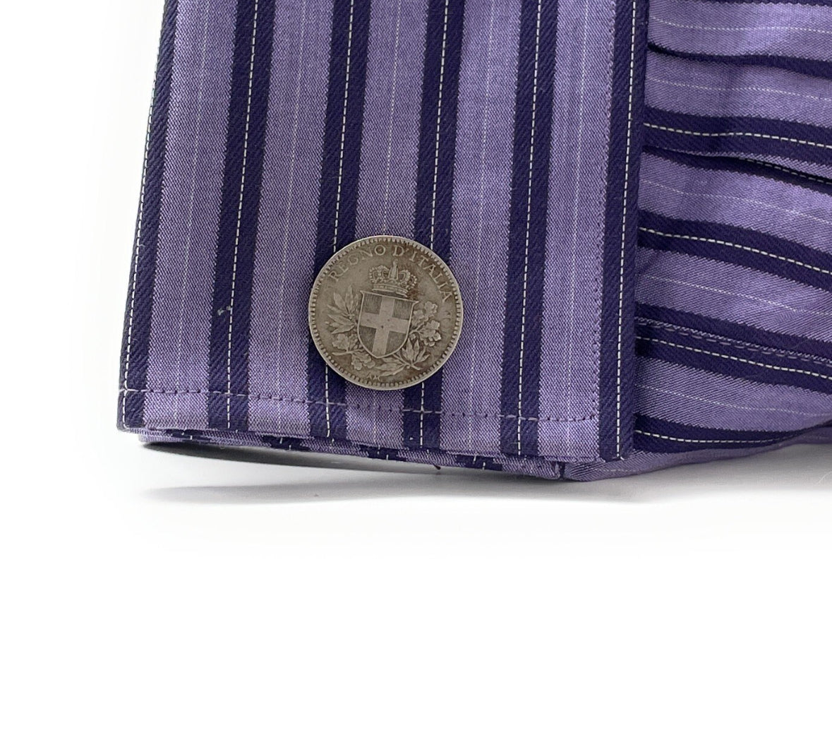 shirt cufflinks A pair of silver-colored cufflinks featuring inscriptions and national emblems, indicative of Italian origin.