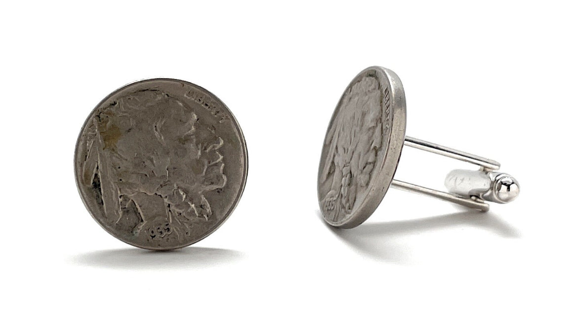 A pair of silver Indian Head nickel cufflinks with a rhodium plating and a bullet backing.