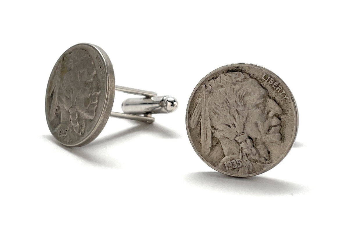 A pair of silver Indian Head nickel cufflinks with a rhodium plating and a bullet backing.