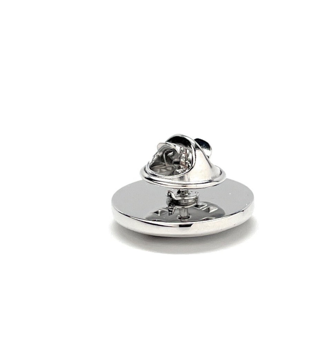 A round enamel pin with a silver rhodium plated backing, featuring a design with stars and stripes, and the text 'KING OF THE DAREDEVILS'.