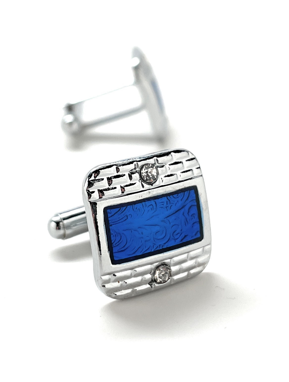 Cufflinks with blue square design on a white background