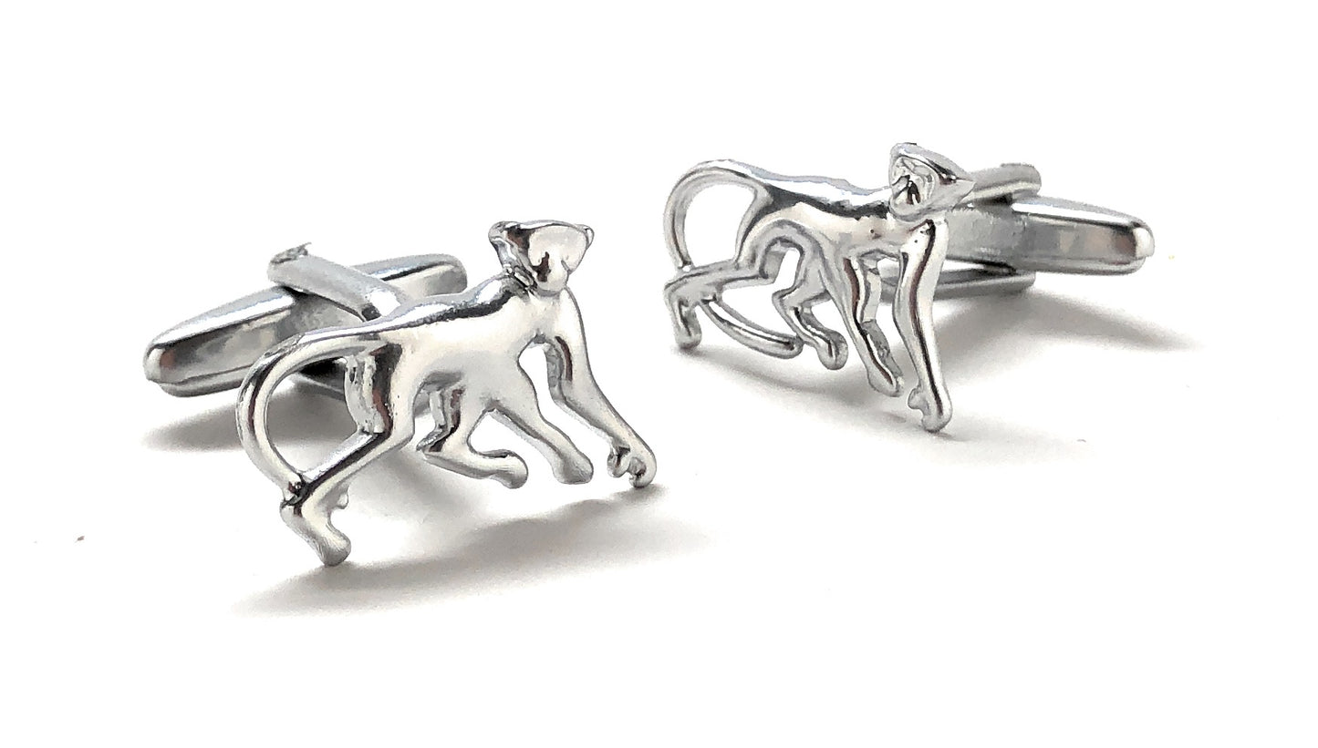 Silver monkey-shaped cufflinks on a white background
