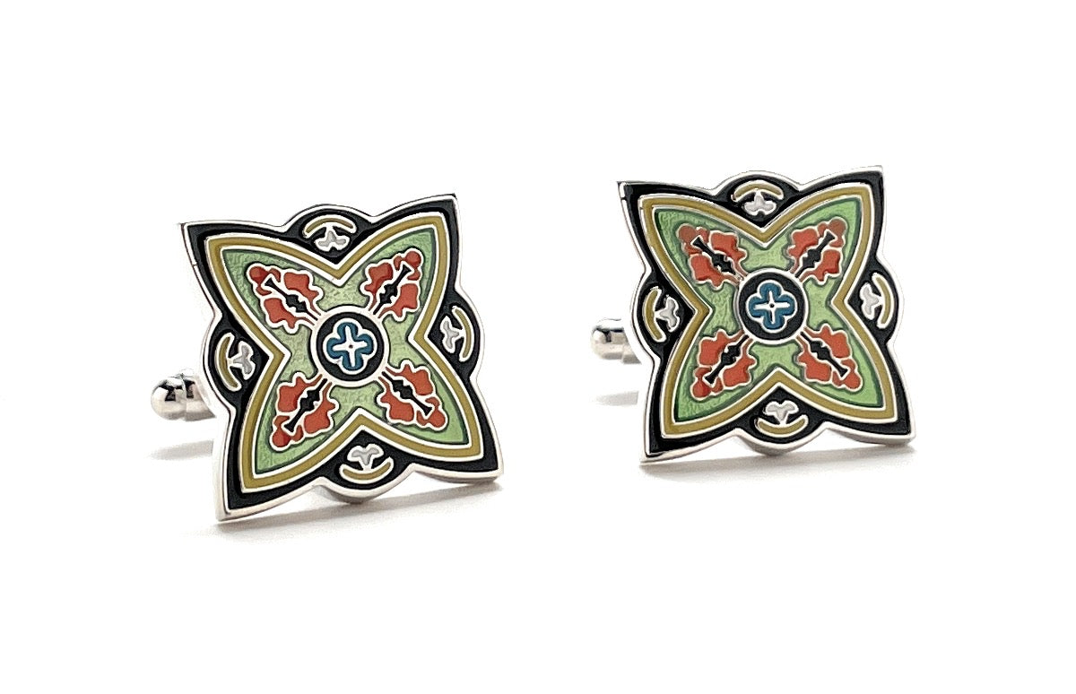 Pair of decorative cufflinks with a geometric design on a white background