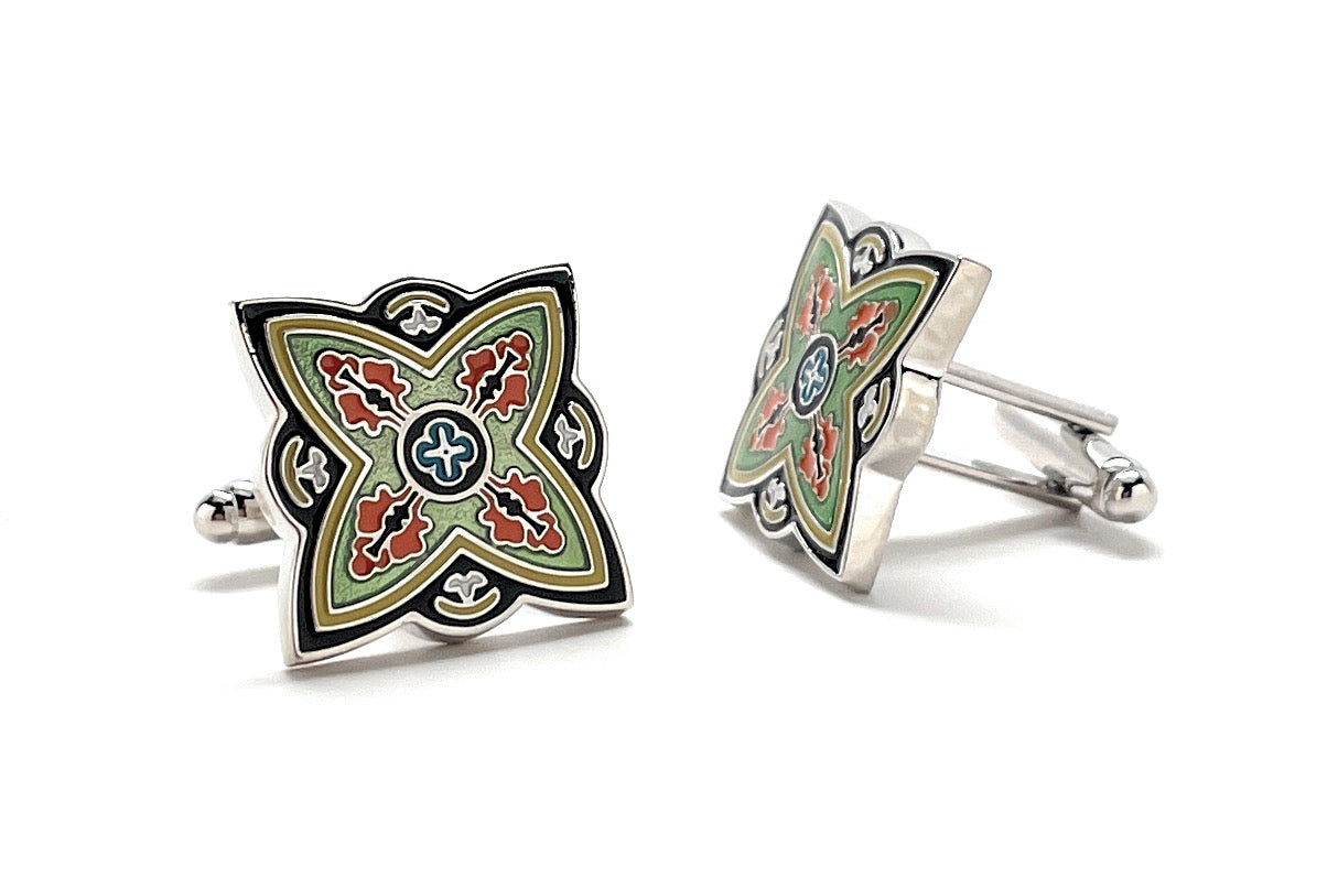 Decorative cufflinks with a geometric design on a white background
