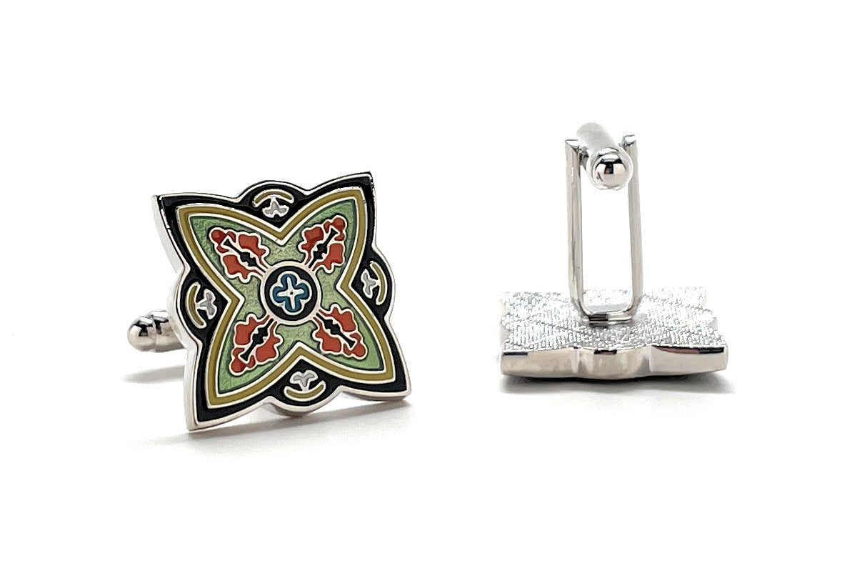 Decorative cufflinks with a floral design on a white background