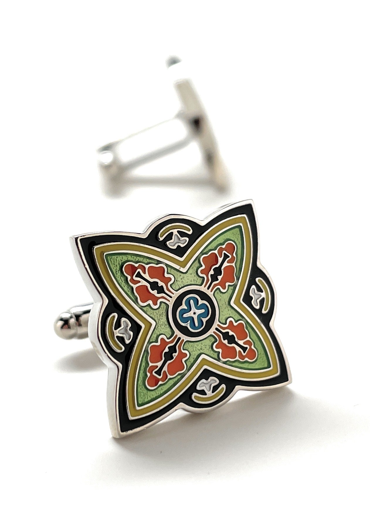 Decorative cufflinks with a colorful geometric design on a white background
