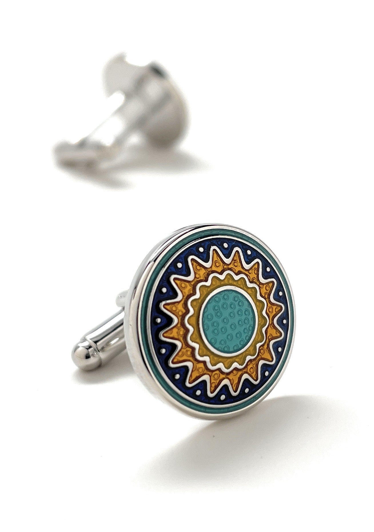 Cufflinks with a sun design on a white background