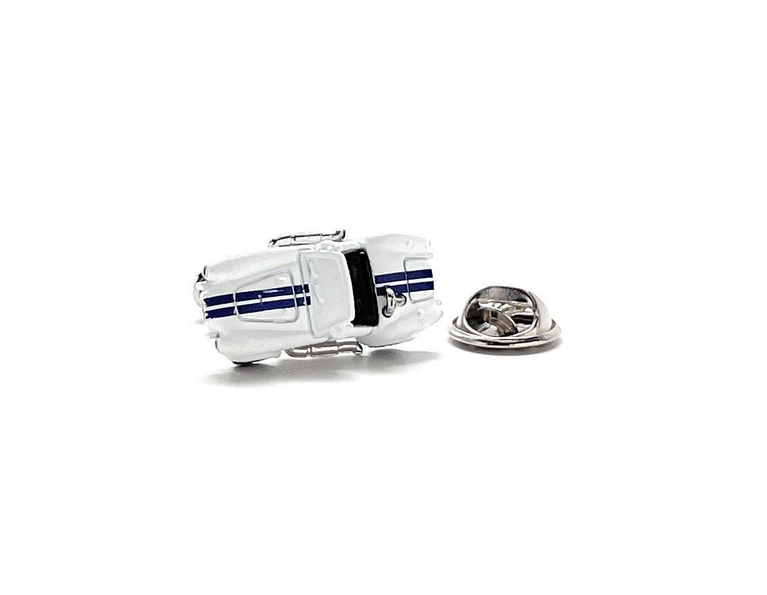 Car-shaped lapel pin with blue and black stripes on a white background