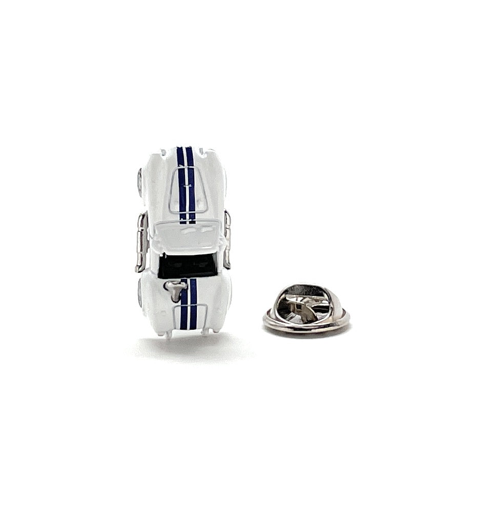 Car-shaped lapel pin on a white background
