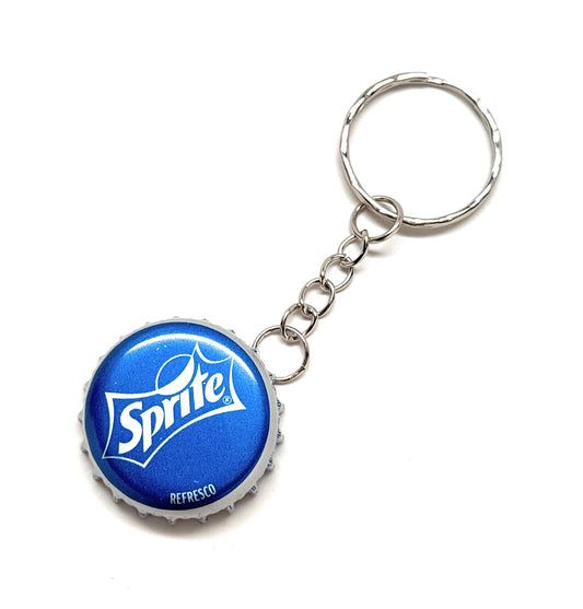 A blue and white vintage Sprite bottle cap keychain with a metal ring on a white background.