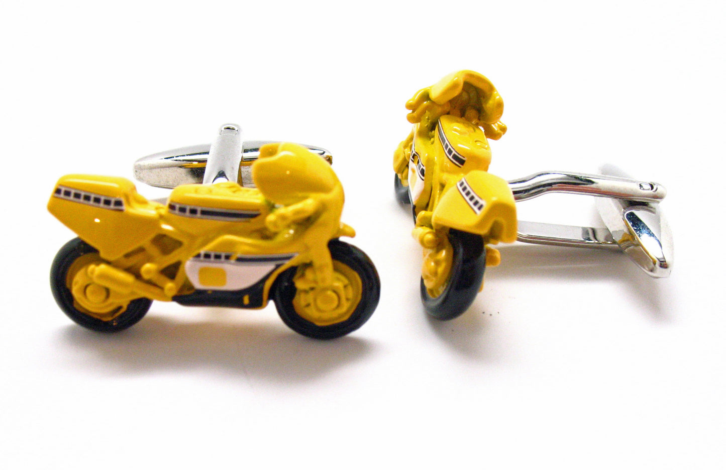 Yellow motorcycle-shaped cufflinks on a white background