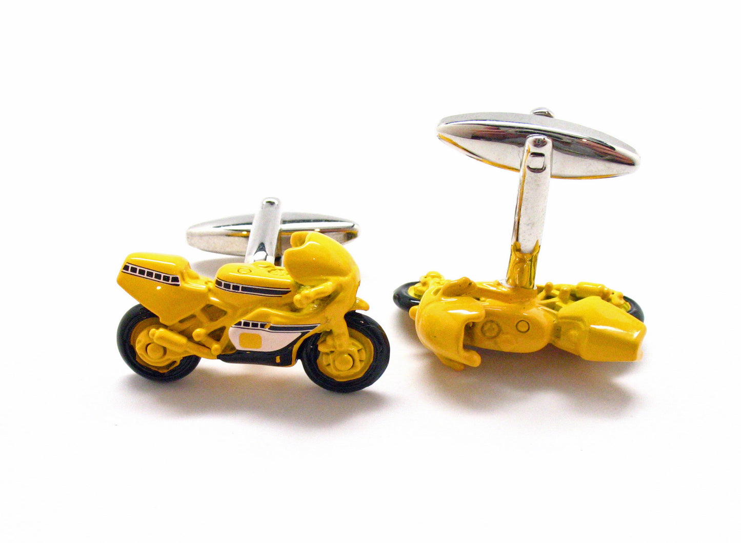 Yellow motorcycle-shaped cufflinks on a white background