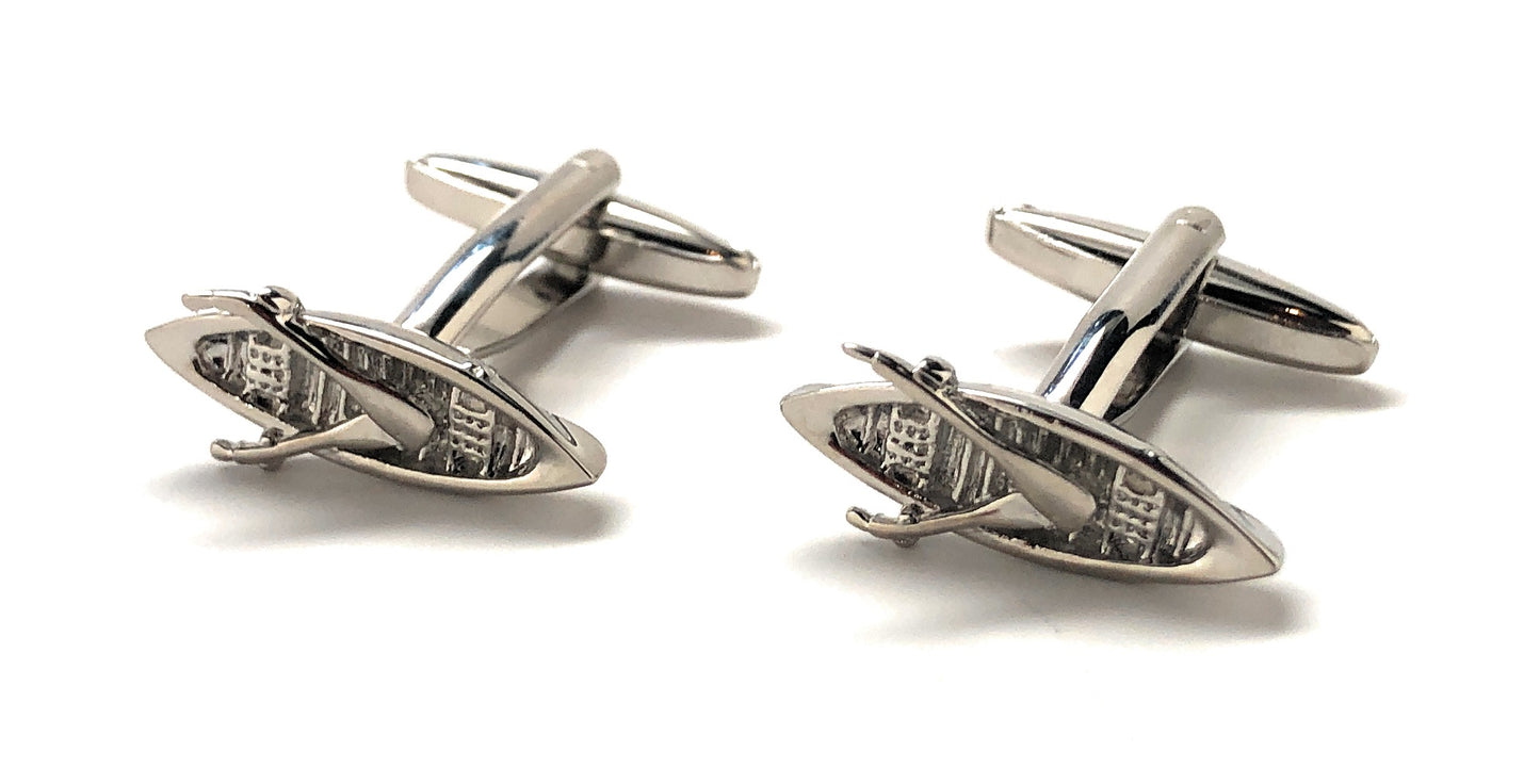 Pair of silver surfboard-shaped cufflinks on a white background