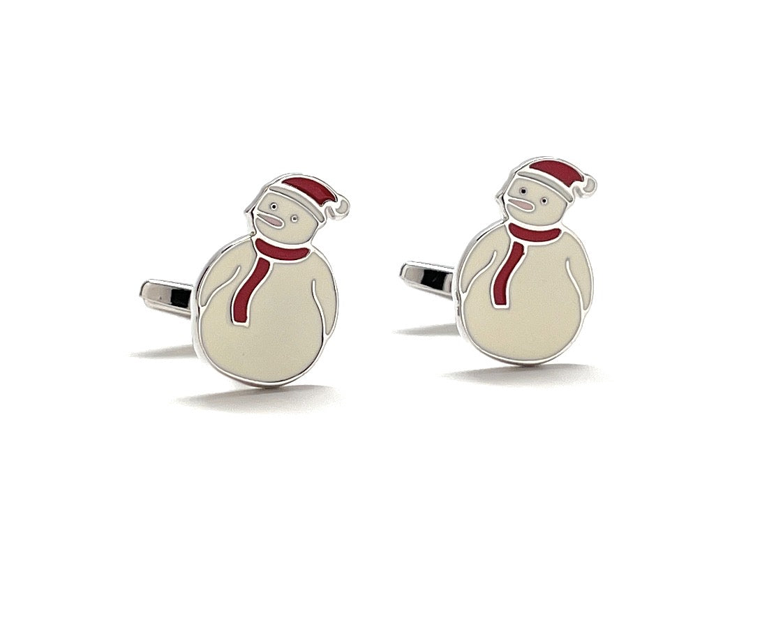 Pair of snowman-themed cufflinks with red scarves and hats on a white background