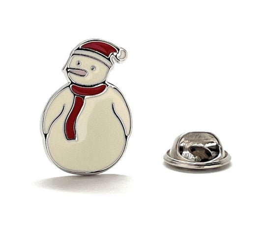 Snowman-shaped lapel pin with a red scarf and hat on a white background