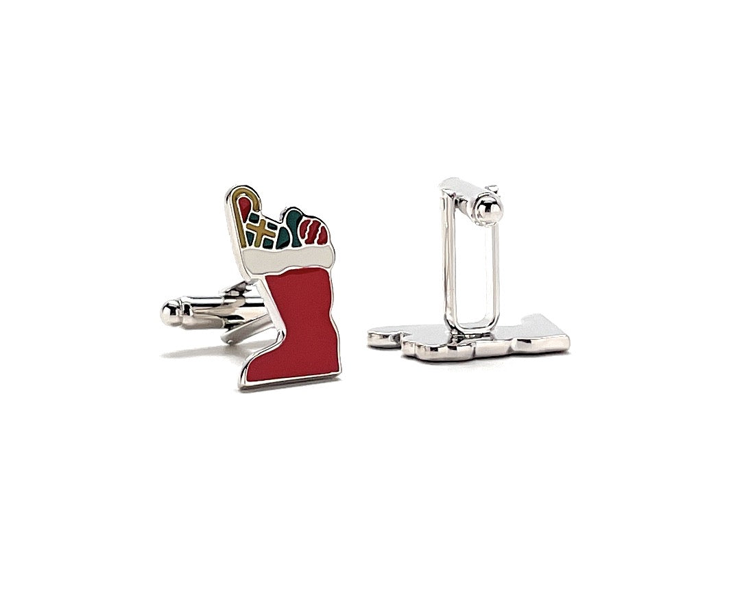 Red stocking cufflinks with silver clasp on a white background