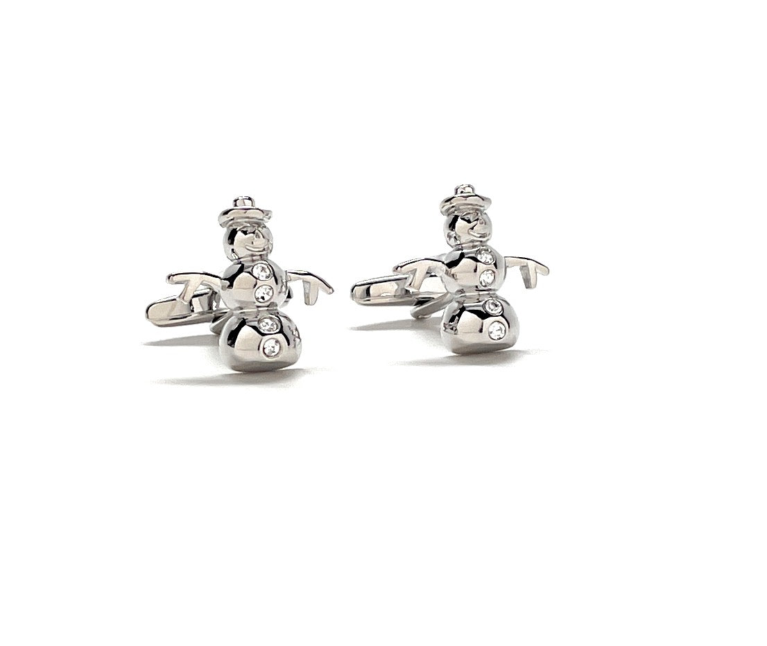Silver snowman cufflinks on a white background