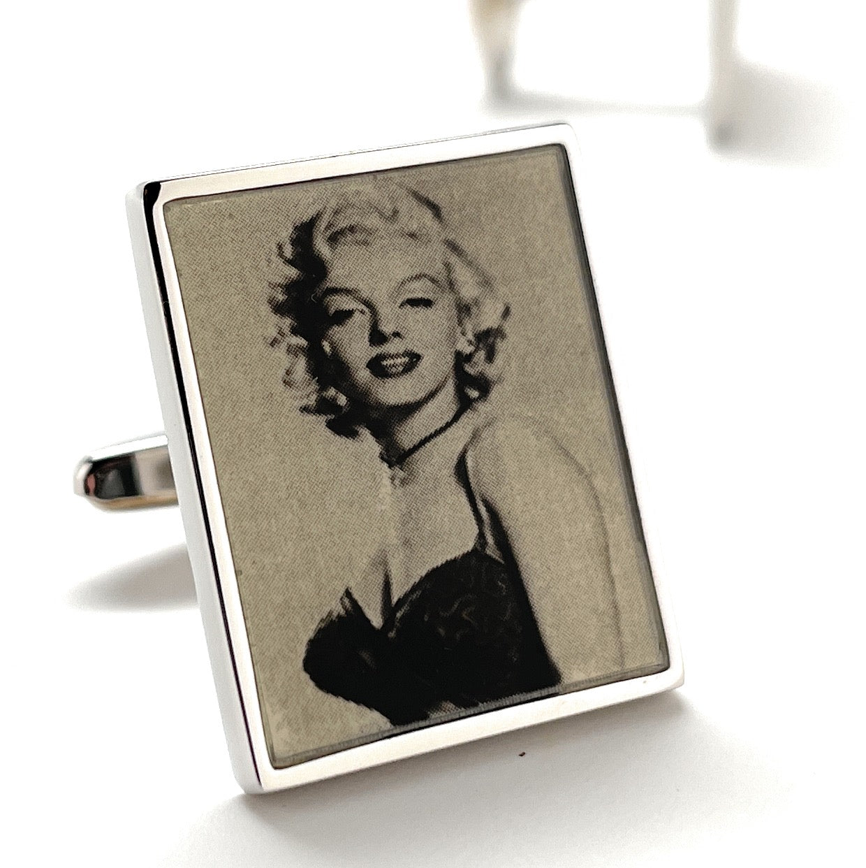 Cufflinks with a portrait of a famous actress on a white background