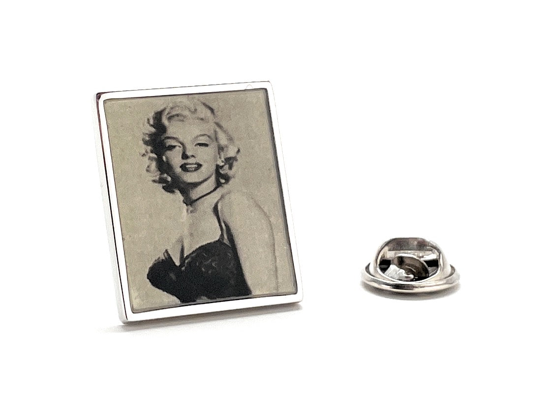 Pin with a portrait of a famous actress on a white background