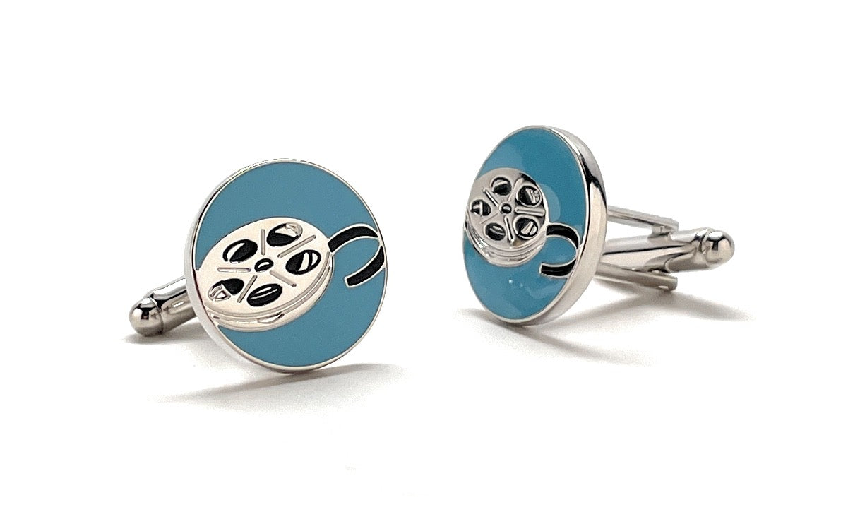 Cufflinks with film reel design on a white background