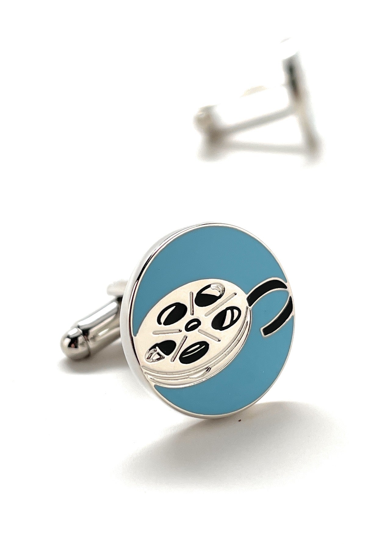 Cufflinks with a blue round design featuring a film reel on a white background
