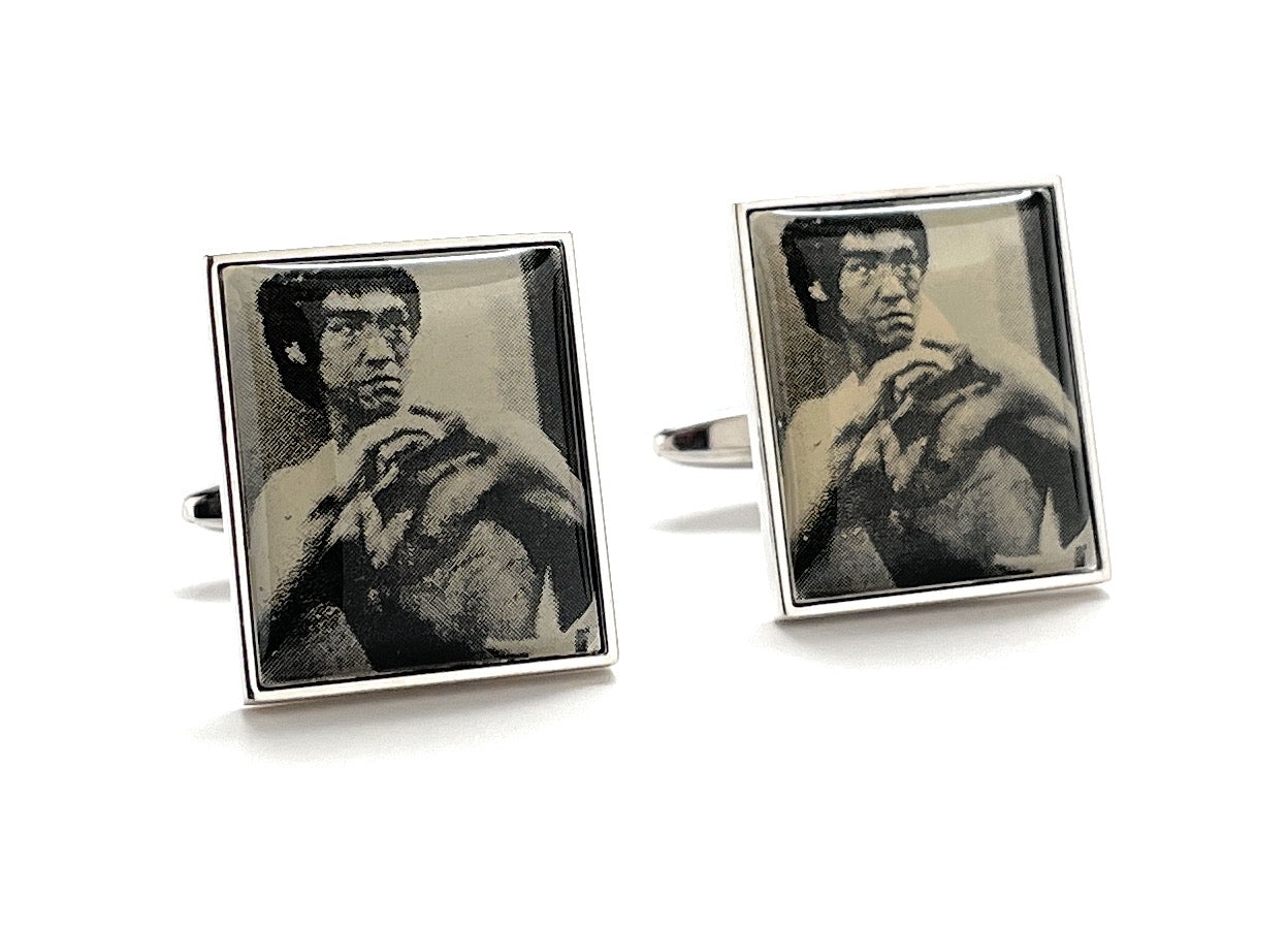Cufflinks with a black and white photo of a martial artist on a white background