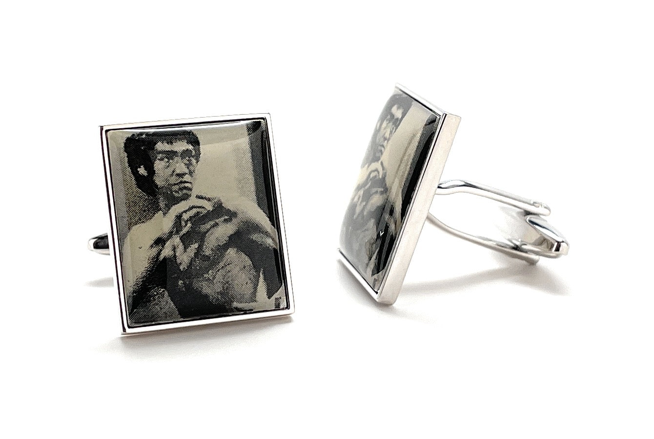 Cufflinks with black and white images on a white background