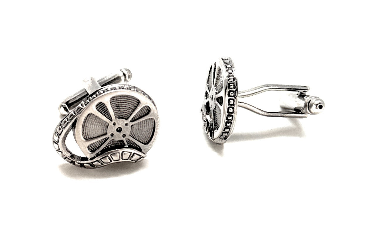 Pair of silver cufflinks on a white background