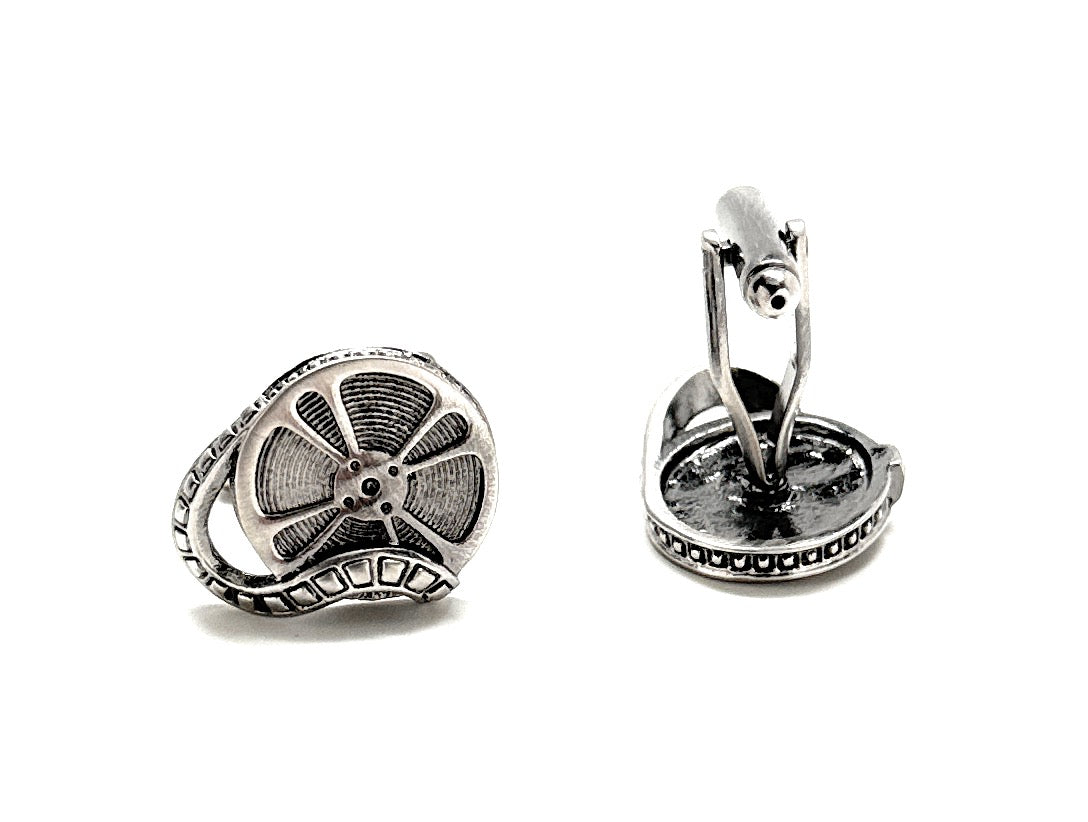 Silver car wheel cufflinks on a white background