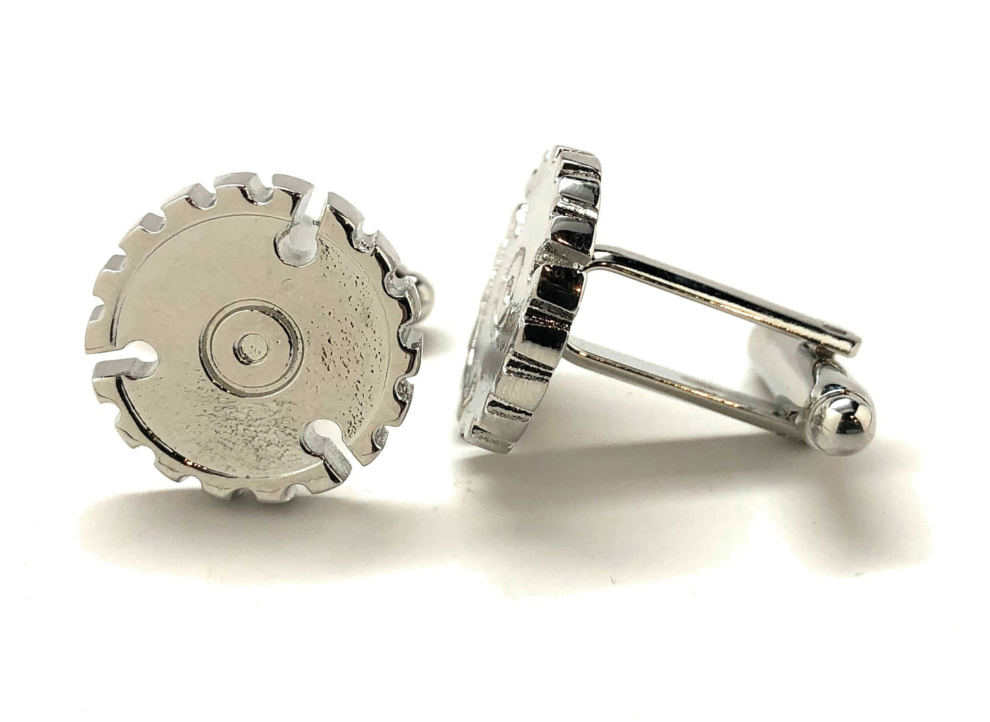 Silver gear-shaped cufflinks on a white background