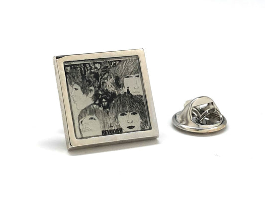 Square pin with black and white image of a person and 'BEATLES' text on a white background
