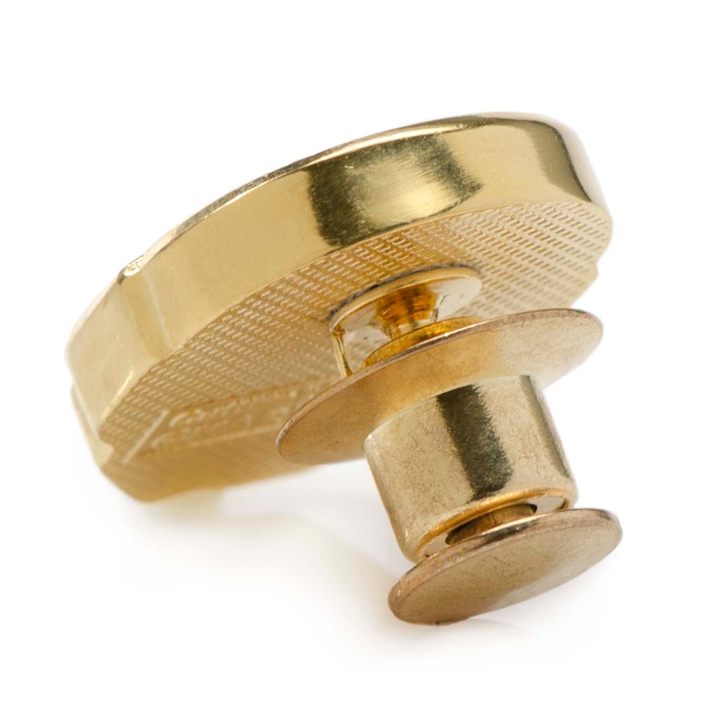 Gold metal knob on a white background