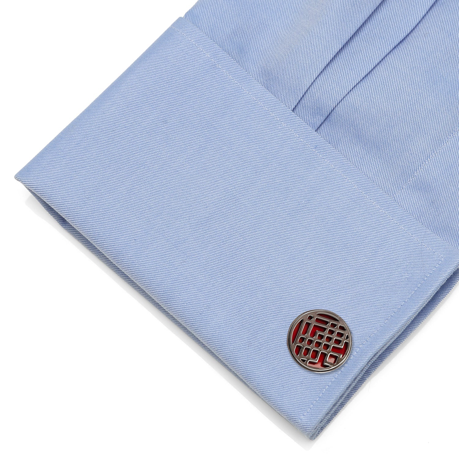 Cufflink on a light blue shirt cuff Red enamel Shang-Chi cufflinks close-up