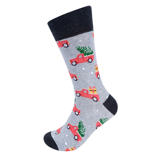 A pair of gray novelty socks with a Christmas-themed design featuring trucks and trees, intended for men's wear.