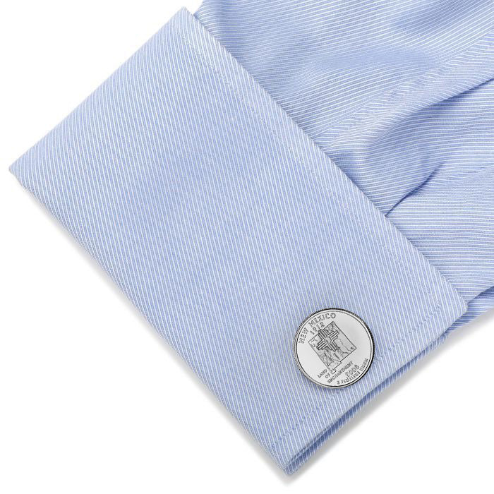 light blue shirt silver cufflinks featuring the design of a New Mexico state quarter coin with an inscription that reads 'NEW MEXICO 2008'.