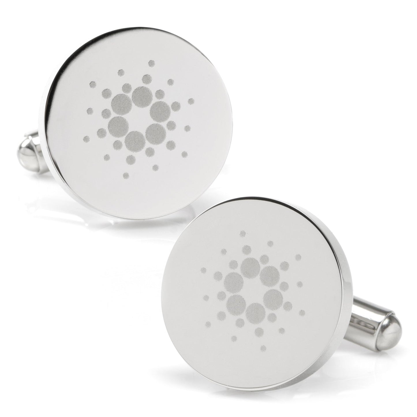 Round silver cufflinks with a pattern on a white background