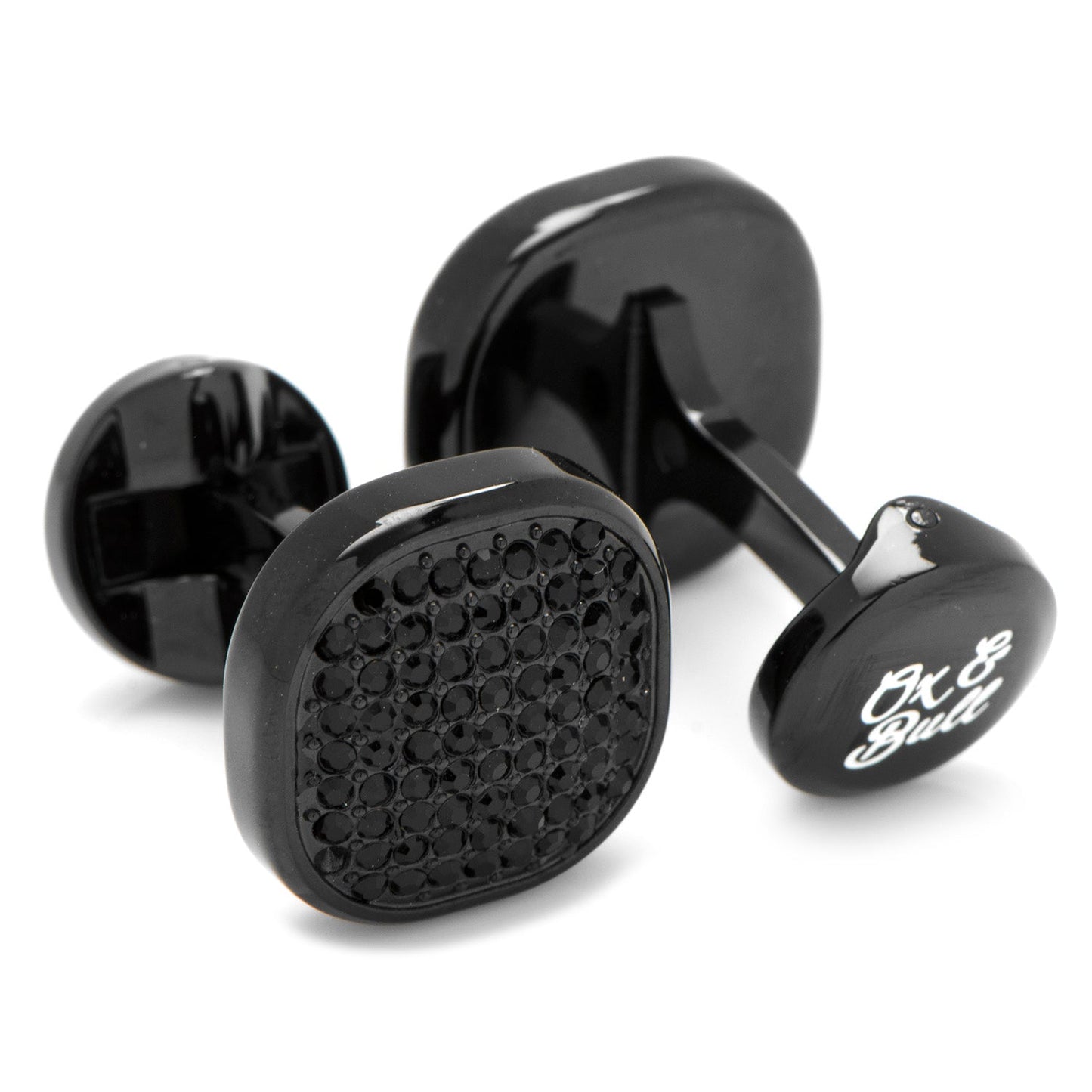 Black cufflinks with textured design and brand name on a white background